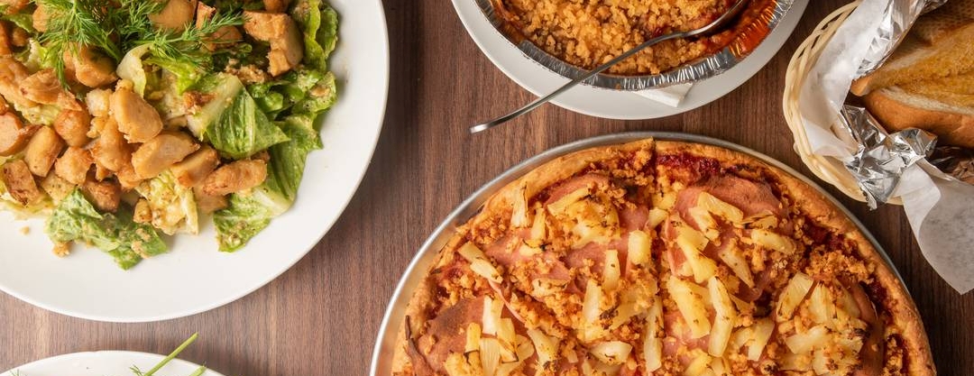 Vegan Pizza House salad, pizza, and sides